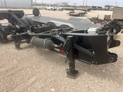 Load KingSB141/2-NS-43 trailer chassis with hydraulic cylinders and hitch, side view showing first axle, winch hose, and metal frame components.