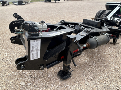 Load King trailer hitch assembly showing hydraulic line, winch, and frame with label plate visible.