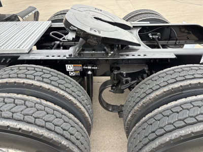 Peterbilt 579 chassis and fifth wheel area showing dual rear axles and fifth wheel mounting with visible tires and frame.