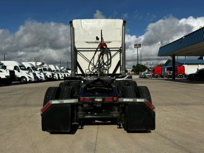 Rear view of a 2020 Mack AN64T70 tractor with fifth-wheel and dual rear axles, chassis, air lines, and mud flaps visible.