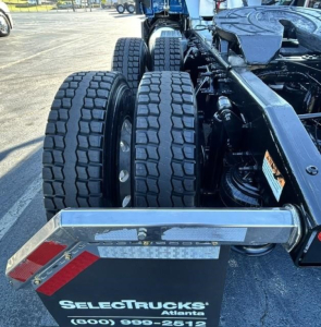 Truck rear view showing dual rear axles and bumper with SelectTrucks Atlanta logo plate.
