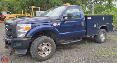 Ford F-350 Super Duty with utility utility box and plow, blue cab over 4x4 work truck, front left view showing side toolbox and plow mount.