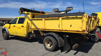 Dump truck body and plow mounted on a 2011 Dodge Ram 5500 chassis cab in yellow, side view showing dump bed, plow frame, and dual rear wheels.