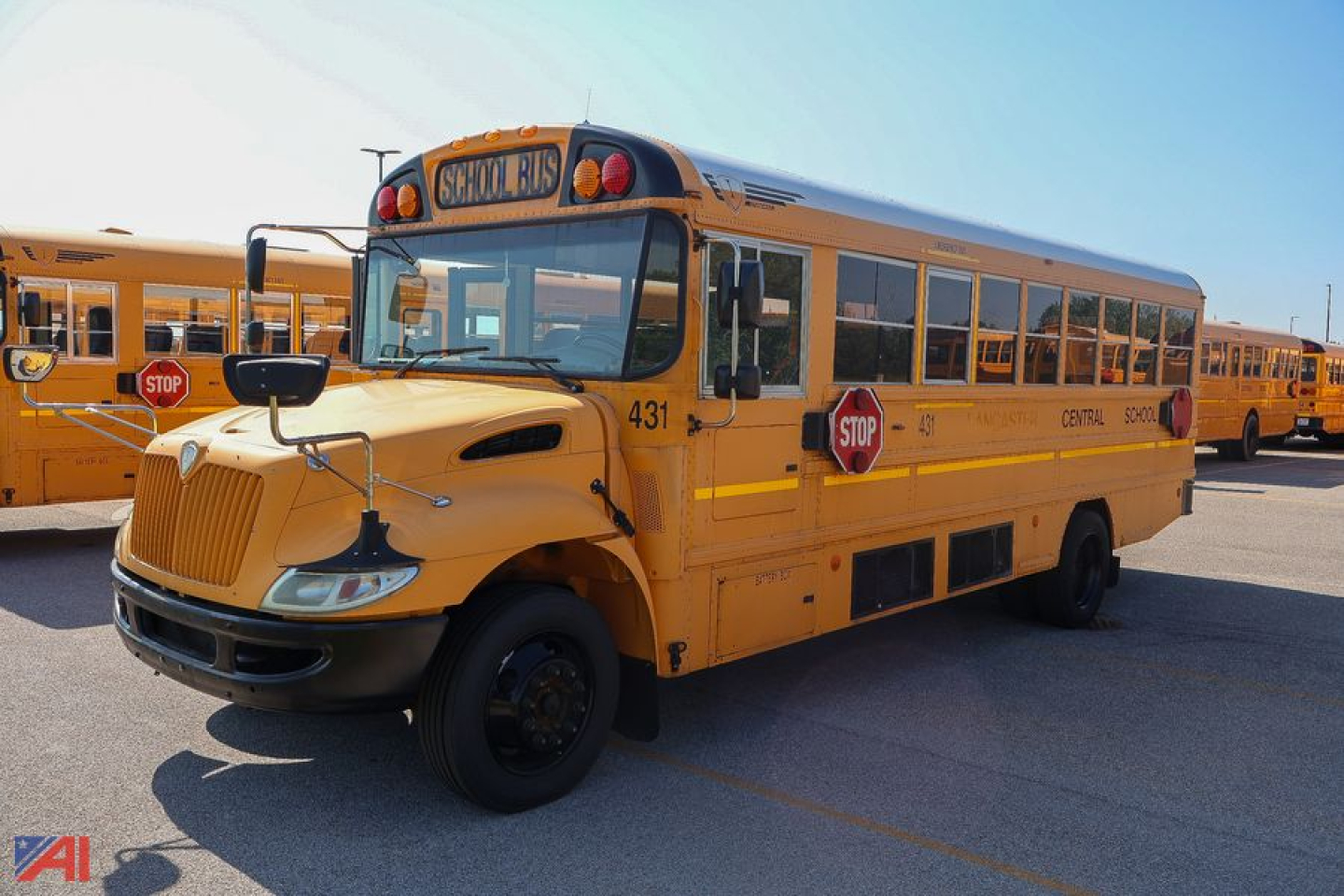 IC Corporation CE Series school bus front-left view showing stop signs and yellow body.