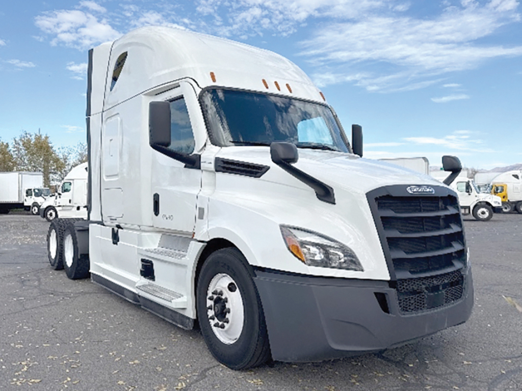 Truck cab side view of a white 2022 Freightliner Cascadia126 sleeper with black grille and mirrors, VIN 3AKJHHDR6NSMT0204 visible in listing context.