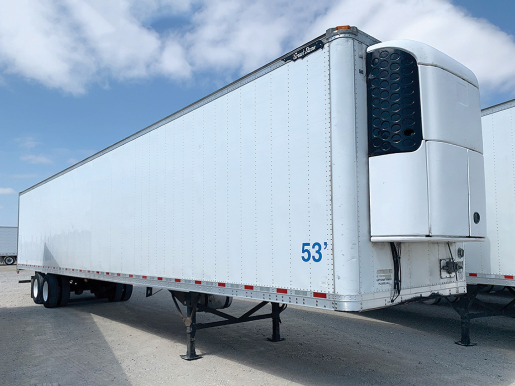 Reefer trailer showing a Great Dane multi-temp refrigeration unit at the front with blue 53' markings on a white trailer.