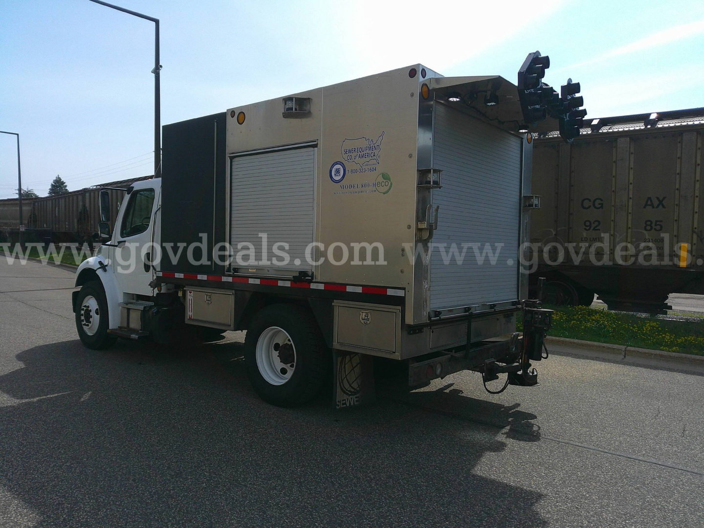 2018 Freightliner M2-106 service truck with utility body, side compartments, and rear equipment mount showing VIN 1FVACYFC6JHJX6747, stock number 8283-867.