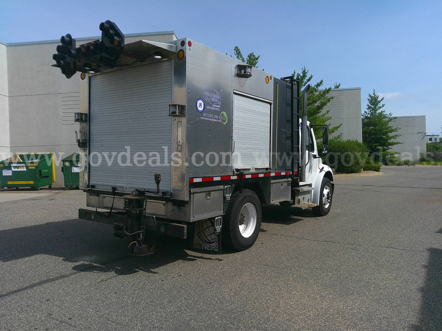 Service/utility truck rear and side view showing equipment compartments on Freightliner M2-106.