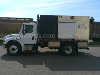 Service/Utility truck side view showing utility box and cab with Freightliner M2-106 design.
