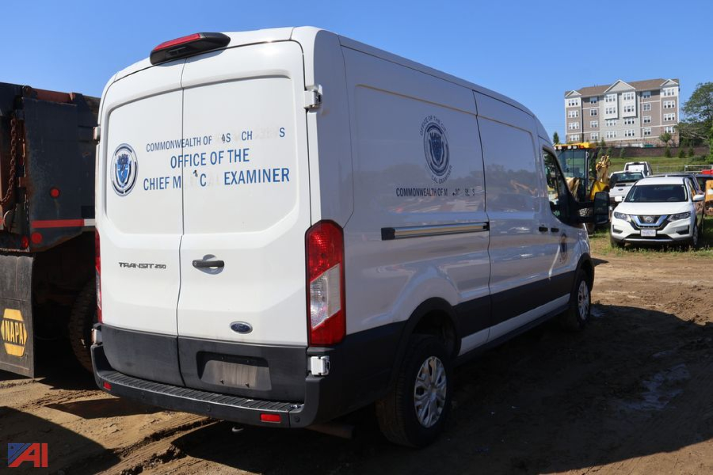 2021 Ford Transit 350 van body rear view showing Office of the Chief Medical Examiner logo and text on side, white cargo van.