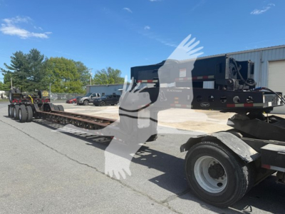 Lowboy trailer with 2014 Etnyre beam showing long flatbed and dual rear axles, VIN 1E9316178EE111298, stock 7674, categorized as lowboy trailer in-used condition.
