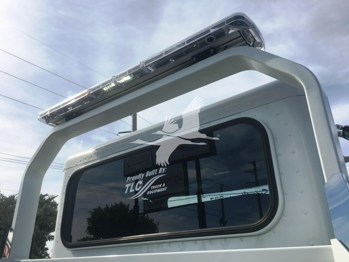 Peterbilt 337 rollback truck rear window with ladder and light bar on top, stock J51806.
