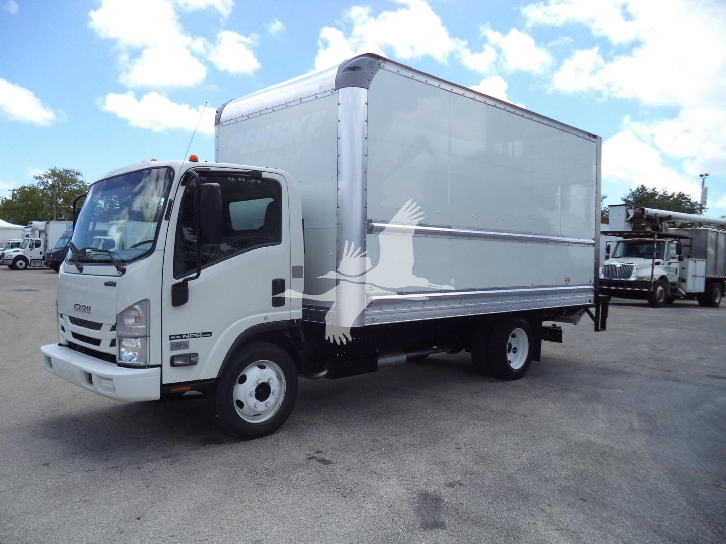 Isuzu NPR HD box truck in front view showing cargo box and cab with white exterior.