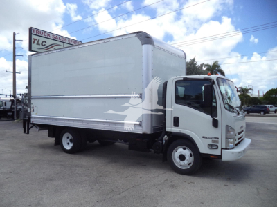 Isuzu NPR-HD box truck with a large white cargo box and cab; side shows faint graphic of a bird; street lot with sign in background