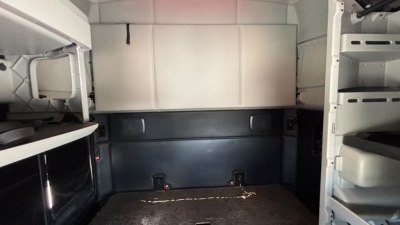 Kenworth T680 cab interior cargo area showing empty rear compartment with side shelves and vertical panels