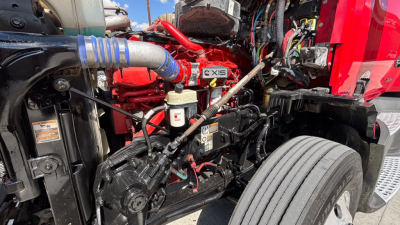 Kenworth T680 engine bay view showing X15 engine and surrounding components.