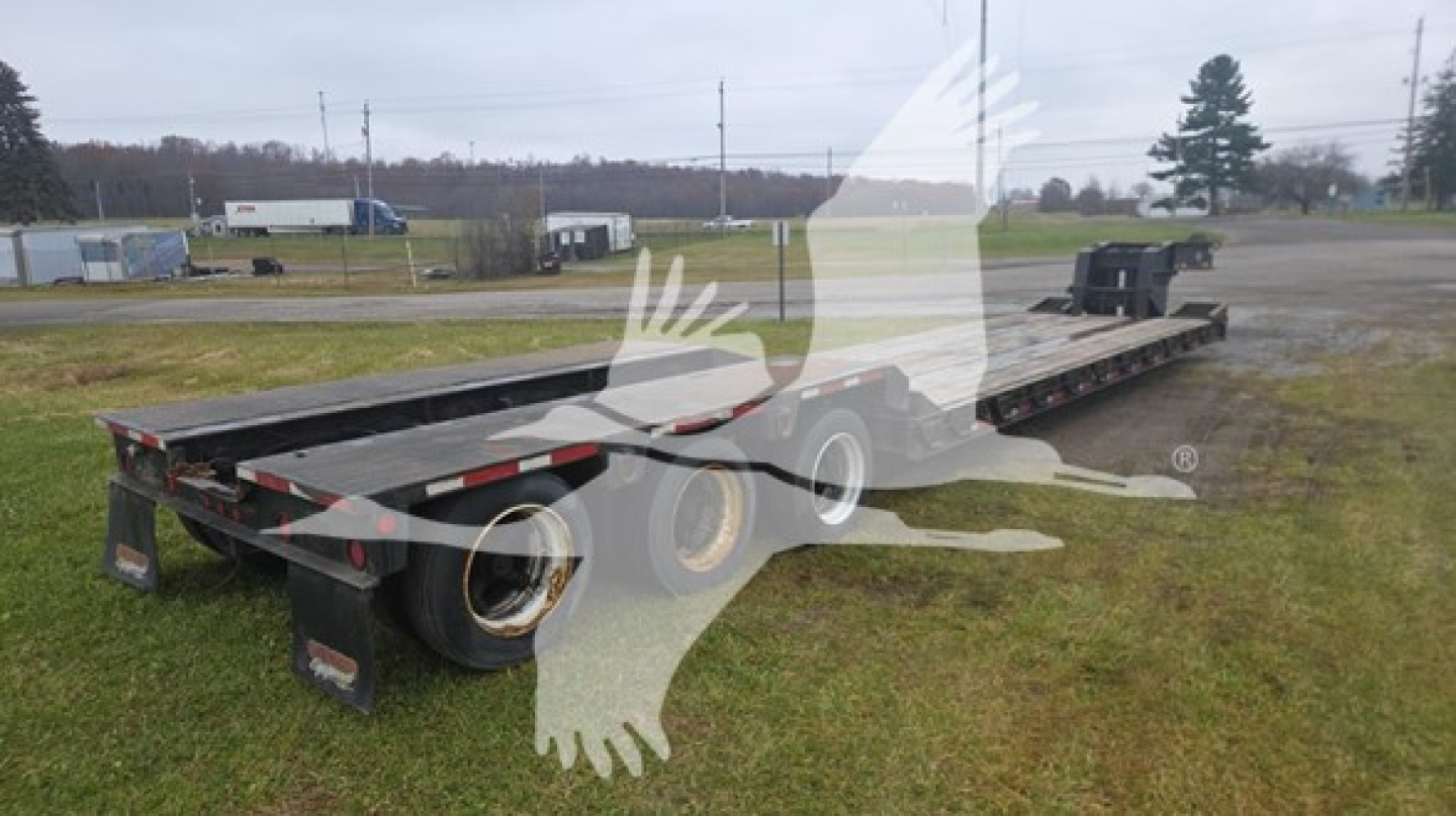 Rogers 50 Ton RGN lowboy trailer showing main deck and wheels, viewed from side with brand and railings absent.