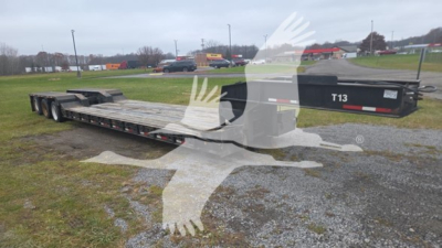 Rogers 50 Ton lowboy trailer with long flatbed and rear multiple axles; side shows 'T13' on the front.