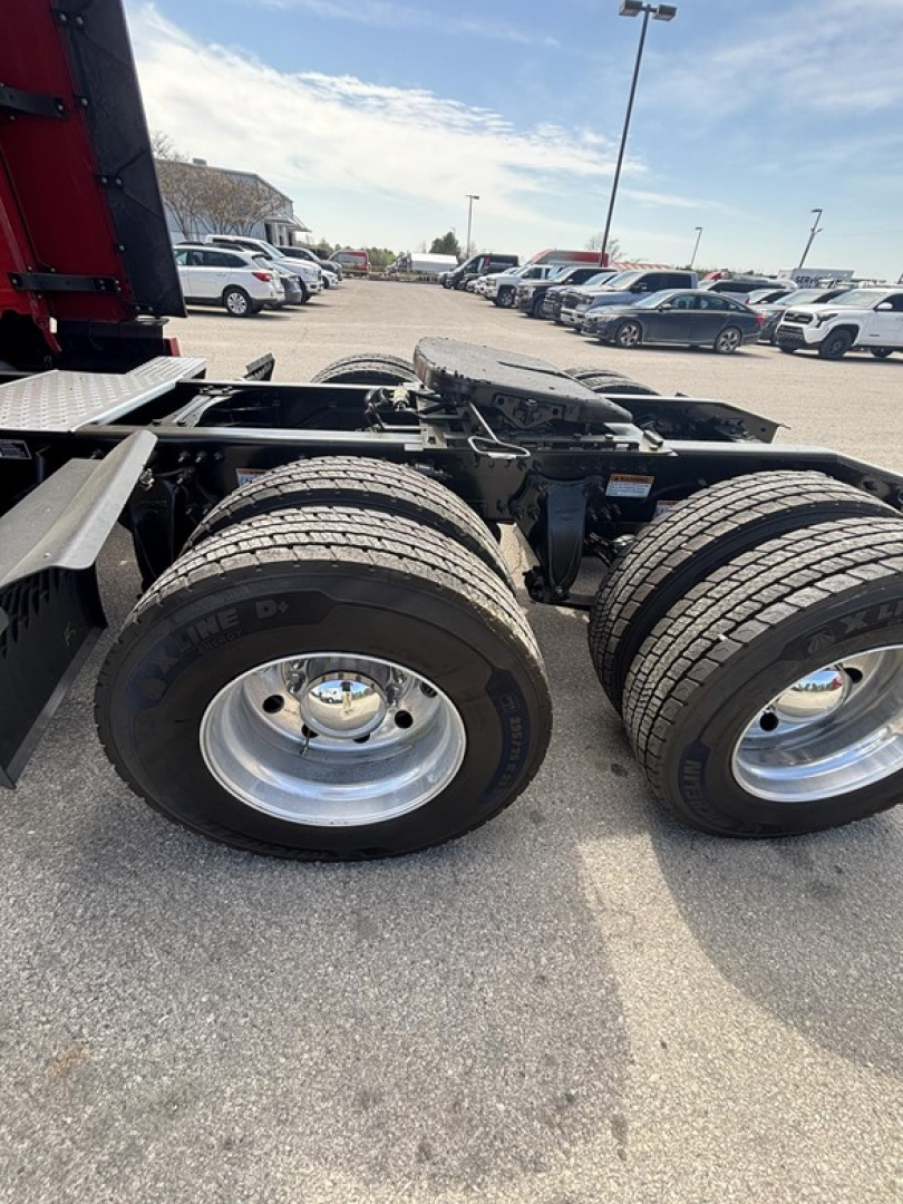 Freightliner Cascadia 126 chassis with dual rear wheels and fifth wheel mount showing tires and frame.