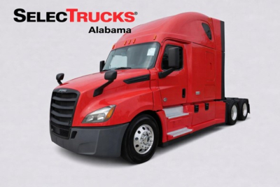 Freightliner Cascadia 126 truck cab exterior with red paint and black grille, side mirrors visible, used vehicle for sale.