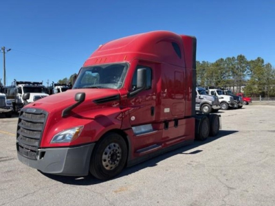 Semi truck cab side view with red Freightliner Cascadia 126, front bumper and wheel arches visible, no readable alphanumeric labels.