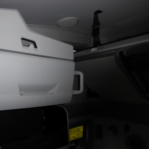 Interior bunk area of a 2026 Volvo VNL64T860 sleeper cab showing overhead storage and seatbelt hardware.