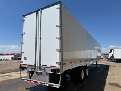 Trailer rear view showing two white-sided Duraplate dry van with rear doors and double tandem axles.