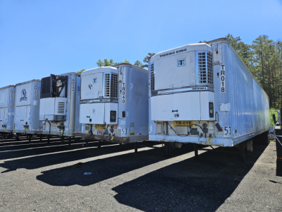 Fleet of refrigerated semi trailers (trailers) with Thermo King units, serial numbers and identification markings visible on doors and sides.