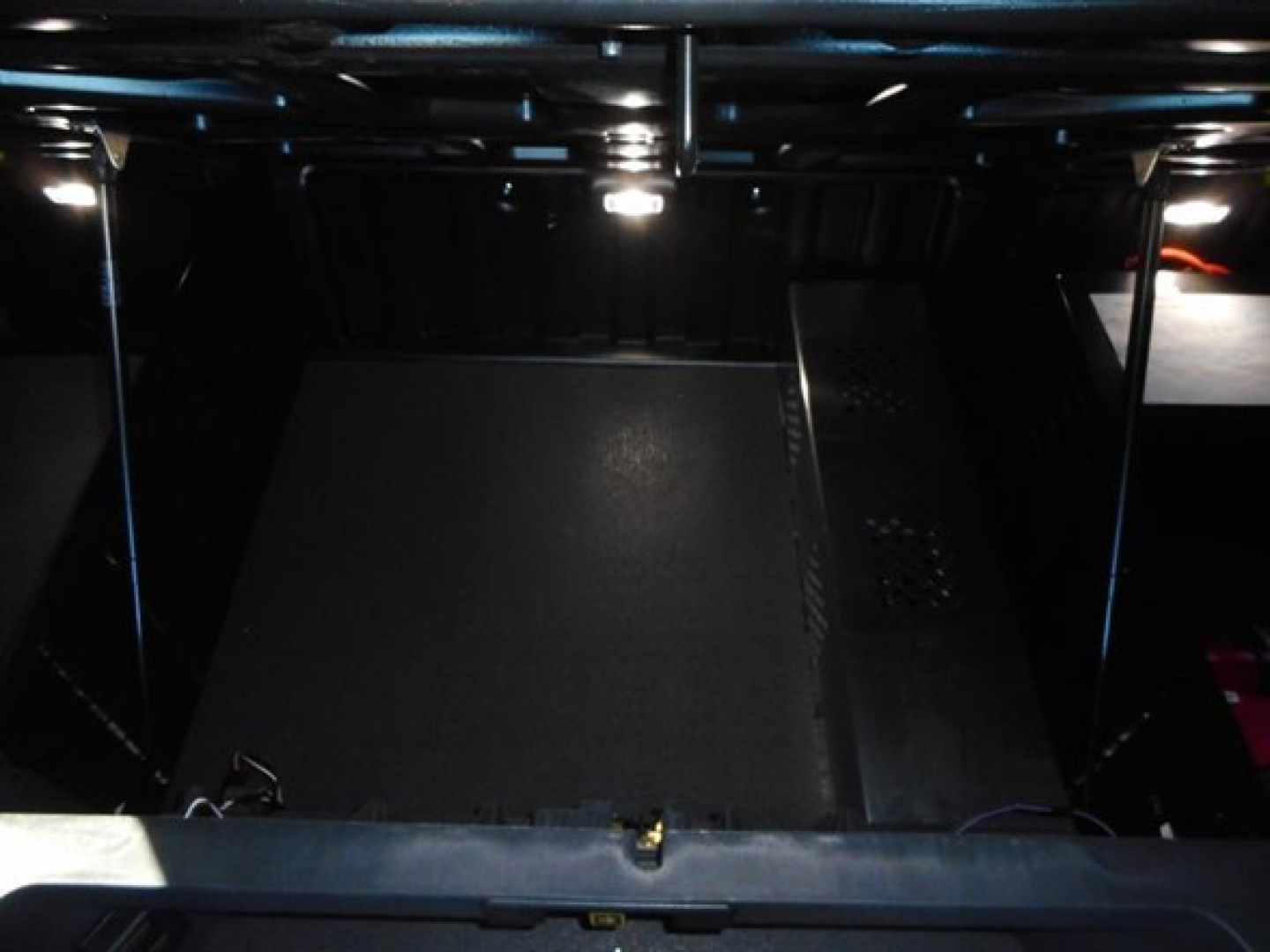 Freightliner Cascadia engine bay area showing storage compartments and chassis supports