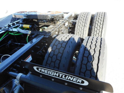Freightliner-branded component on truck chassis with dual rear dual tires and wiring visible