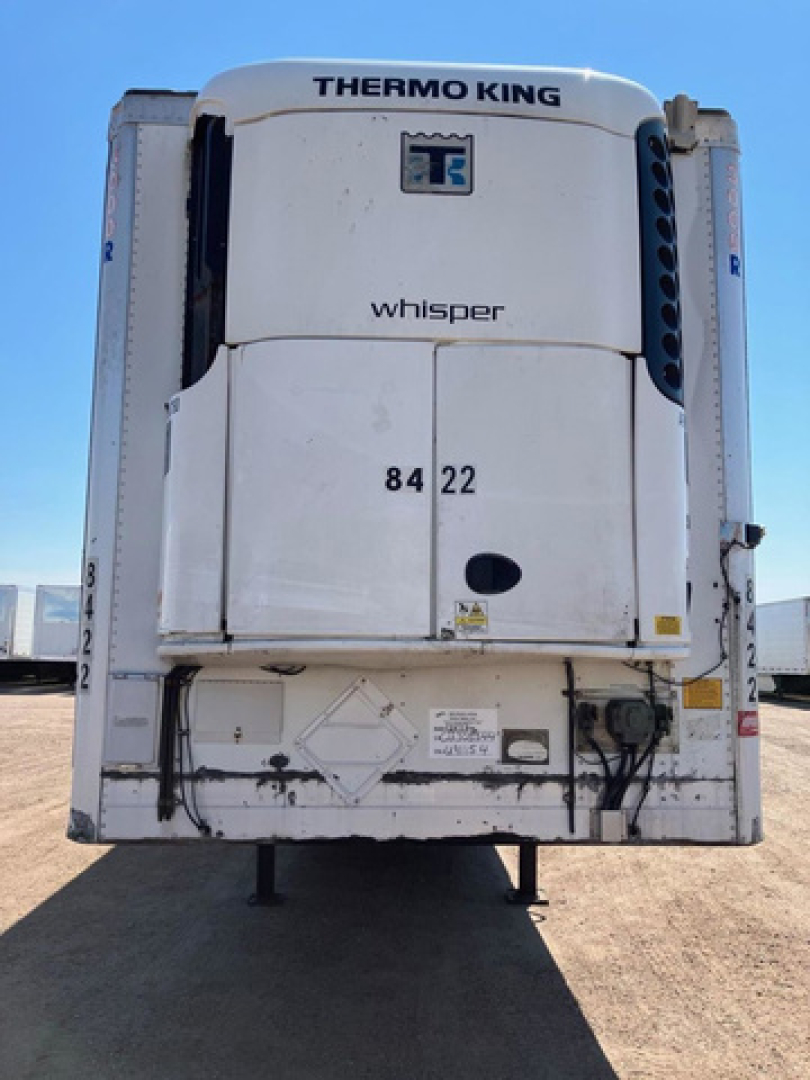 Thermo King Whisper refrigeration unit on a refrigerated trailer rear view showing model branding and access doors with numbers 84 22.