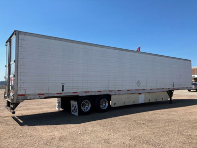 Utility trailer side view showing a refrigerated trailer with tandem axles and a raised landing gear area.