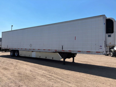 Trailer side view of a 2012 refrigerated utility trailer showing white walls, dual rear axles, and refrigerated unit at front corner.