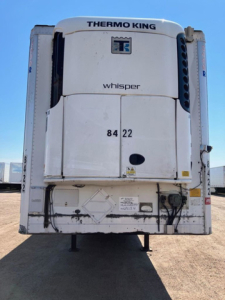 Thermo King Whisper refrigeration unit on a refrigerated trailer rear view showing model branding and access doors with numbers 84 22.