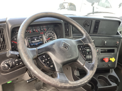 Dashboard and steering wheel of a 2021 International LT625 cab showing instrument cluster and controls.