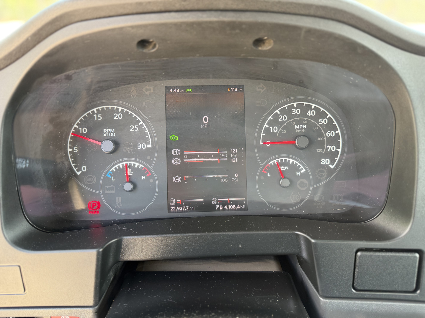 Kenworth T280 dashboard showing instrument cluster with speedometer, tachometer, and digital display; central screen shows various icons and trip data.