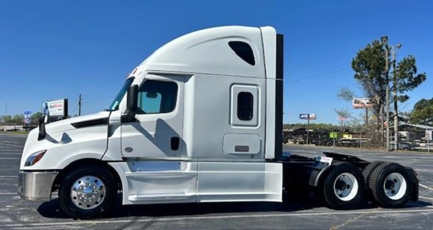 2023 Freightliner Cascadia 126 Conventional Sleeper tractor truck side view showing cab and dual rear axles.