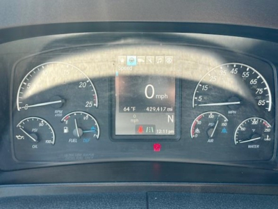 Dashboard of a Freightliner Cascadia 126 showing speedometer, tachometer, fuel gauge, temperature, and digital display with 0 mph and 429.417 miles