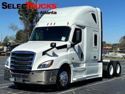 Freightliner Cascadia 126 tractor-trailer front/right view showing aerodynamic sleeper cab and chrome bumper with SelectTrucks Atlanta branding.