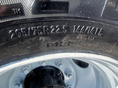 Tire sidewall with markings 295/75R22.5 144/141G on Freightliner Cascadia 126 wheel