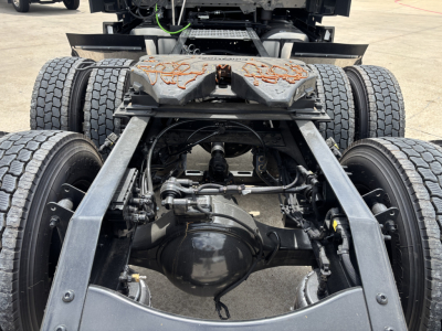Mack PR64T76H tractor rear suspension and driveline showing rear axles and differential with twin rear wheels.