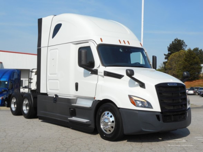 Freightliner Cascadia 126 tractor trailer in white, side view with sleeper cab and black front grille.