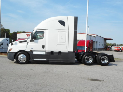 Freightliner Cascadia 126 tractor in side view showing sleeper cab, front fender, dual rear axles, and chrome wheels.