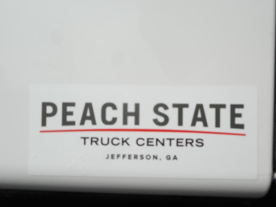 Peach State Truck Centers sticker on white surface.