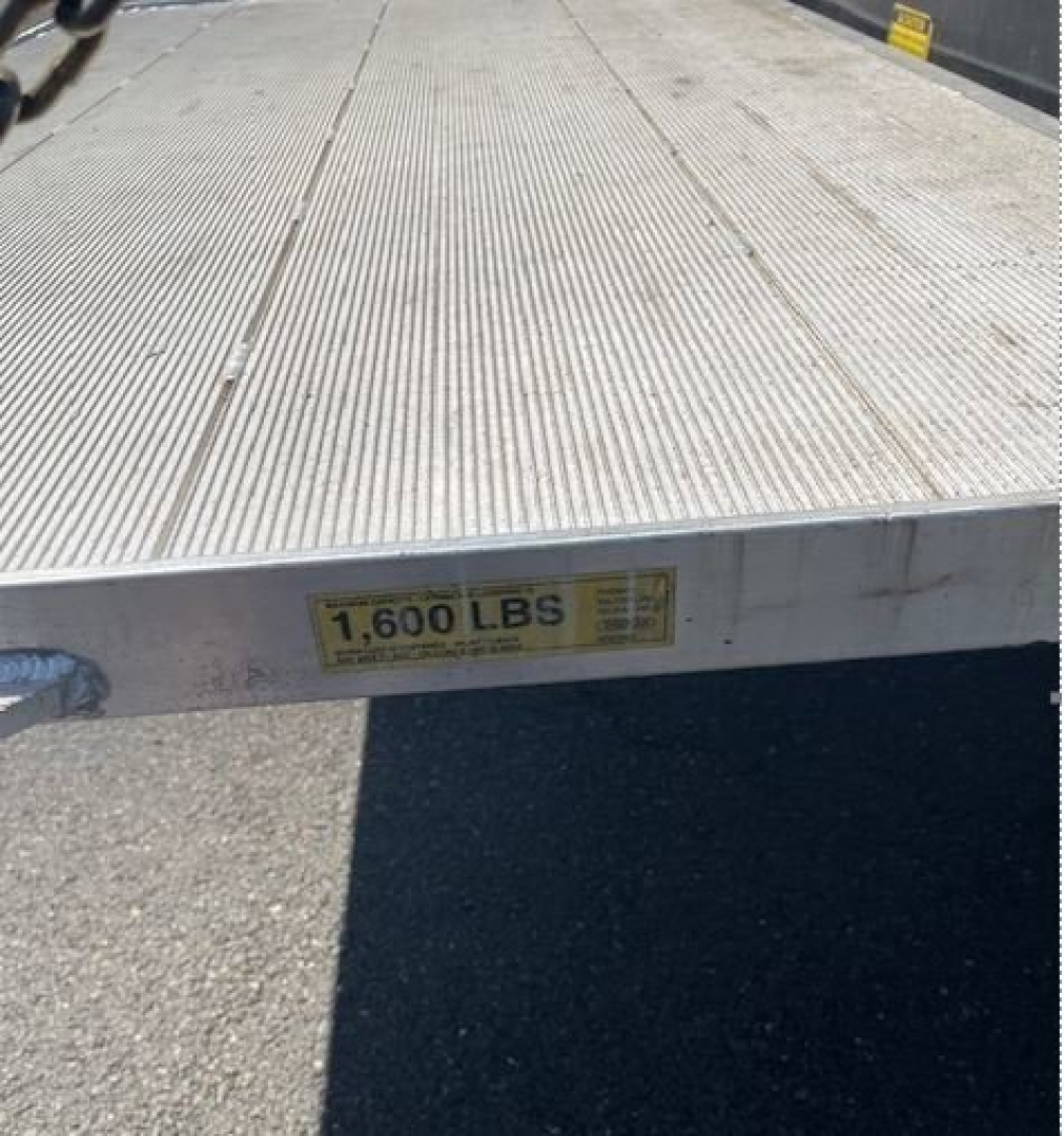Hino 195 box truck flatbed with capacity label '1,600 LBS' visible on edge.