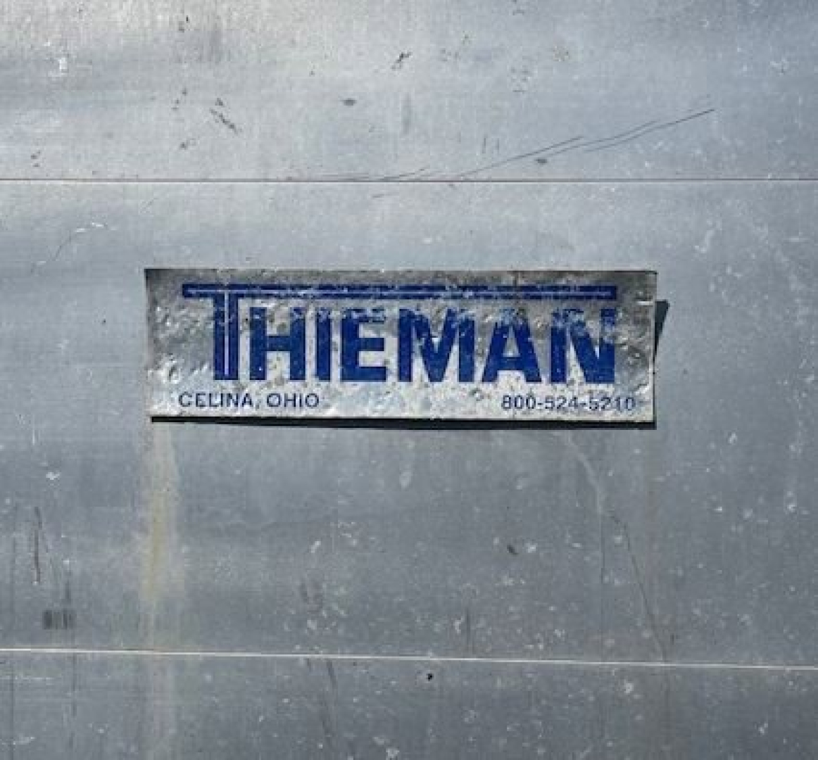 Thieman label on metal surface showing Thieman branding and Celina Ohio contact info.