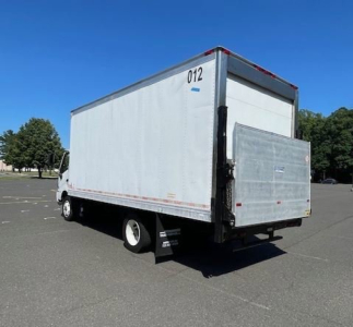 Box truck with white cargo box and rear ramp, side view showing the number 012 on top corner; no readable branding visible.