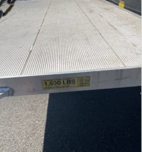 Hino 195 box truck flatbed with capacity label '1,600 LBS' visible on edge.