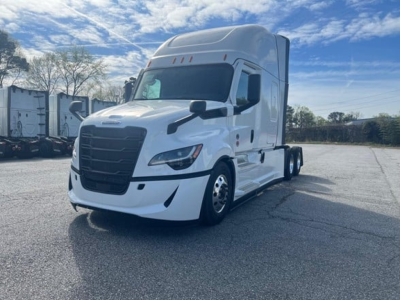 Truck front-left view of a white 2027 Freightliner Cascadia 126 sleeper cab with black grille.