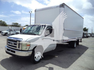 Box truck from 2011 Ford E450 front-left view showing cab, grille, and large box cargo area with stock number T02379.